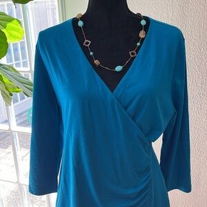 Soft Surroundings Wear Anywhere Faux wrap blouse. color: Lake Blue